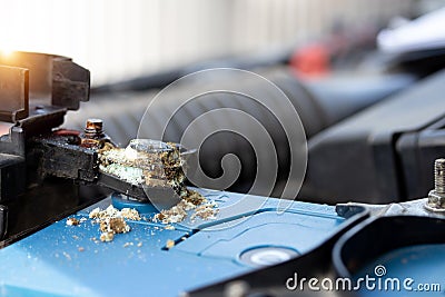 Close up battery terminals corrode dirty damaged problem, Old battery corrosion deteriorate leaking with blue acid powder. Service Stock Photo