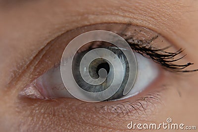 Close up beautiful blue eye opening human iris macro natural beauty Stock Photo