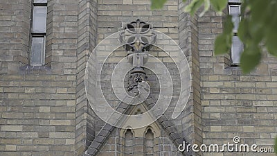Close-up of beautiful facade of ancient church. Action. Architectural symbol of Anglican Church. Beautiful details of Stock Photo