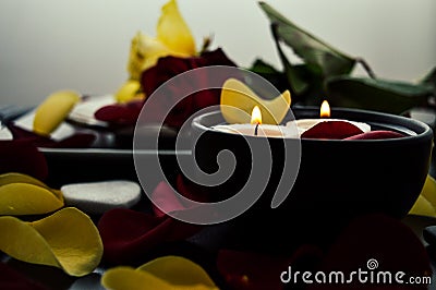 Close-up of a beautiful romantic dinner with flowers petals, roses, candles. Valentine`s day Stock Photo