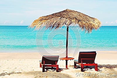 Close up of beautiful straw umbrella,isolated at sunny daytime on the empty paradise tropical beach,relax,no people holiday Stock Photo