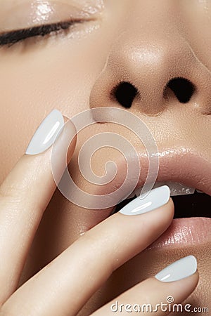 Close-up beauty. Model face with light make-up & manicure Stock Photo