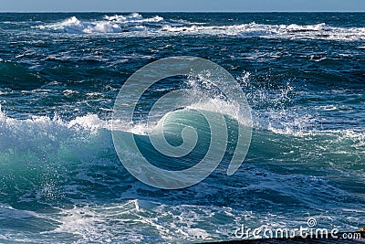 A beautiful striped turquoise wave off the coast at Sennen, Cornwall Stock Photo