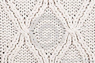 Close-up of beige knitted winter sweater with pattern Stock Photo