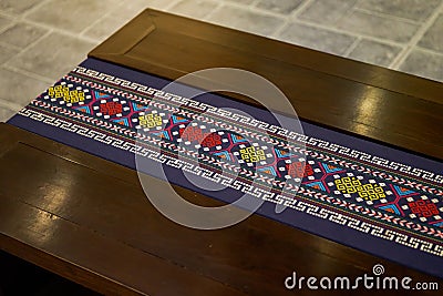 Close-up of a bench decorated with Zhuang brocade, a characteristic of the Zhuang nationality in Guangxi Stock Photo