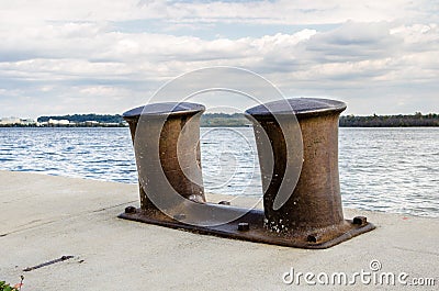 Close up of Big Rusty Bollards Stock Photo