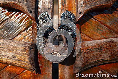 Close-up of big vintage lock of wooden gates. Stock Photo