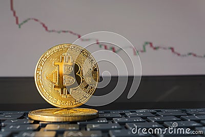 Close up of bitcoin symbol with declining price chart in the cyberspace with virtual screen background. fall of bitcoin exchange Stock Photo