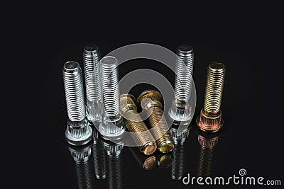 Close-up on black background studs for fastening car wheels Stock Photo