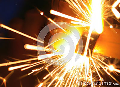 Close up of black burned sparkler producing multiple sparks, created using generative ai technology Stock Photo
