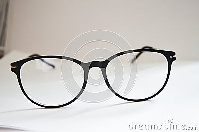 Close up black business glasses on white Stock Photo