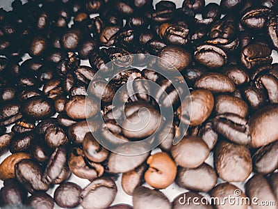 Close up of Black coffee beans with a natural bitter taste, with blurry background Stock Photo