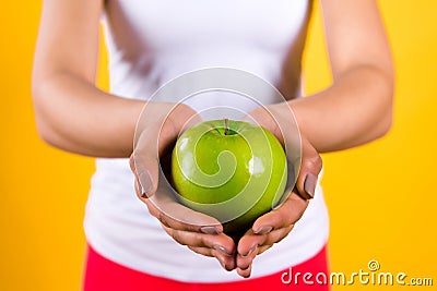 Close up black girl holding apple isolated. Stock Photo