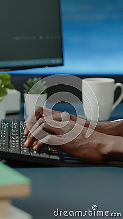 Close up of black hands coding server interface with binary codes Stock Photo