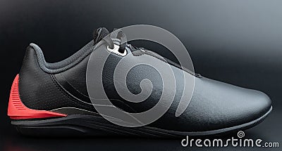 Close up of black leather motosport shoe Stock Photo