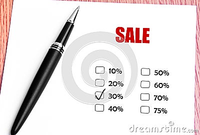 Close Up Black Pen And Checked 30% Discounted Rate At Sale Promotion Stock Photo