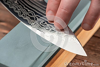 Close-up on a blade made of Damascus steel Stock Photo