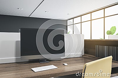 Close up of blank computer monitor in coworking office interior with wooden desk and bright city view. Mock up Editorial Stock Photo