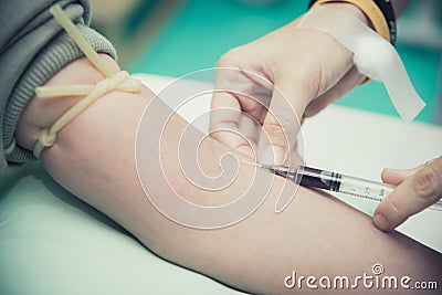 Close up of Blood collecting at arm. People and Healthcare concept. Hospital and clinic theme. Stock Photo