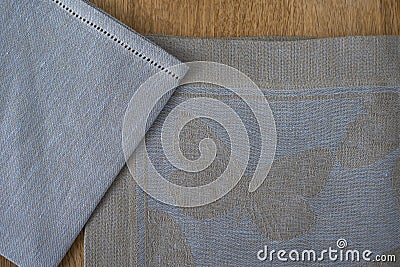 Close-up of Blue and Gray Placemat and Table Napkin Corners Stock Photo