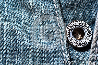 Close up of blue jeans with a lovely decorated button Stock Photo