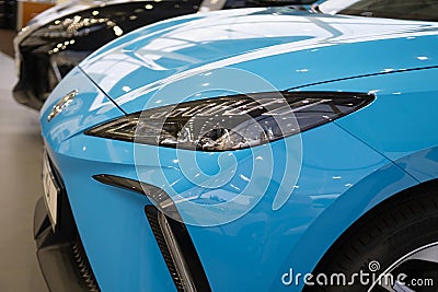 close-up blue MG Car model 4, electric Chinese company brand Nanjing Automobile in showroom, alternative energy, concept Editorial Stock Photo