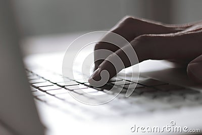 Close up. blurred image of male hand typing on laptop keyboard Stock Photo