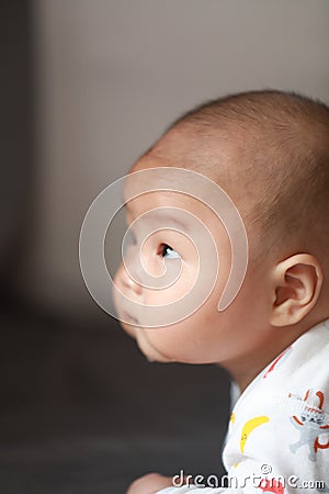 Close-up body parts baby infant chubby head dribble boy is suck eating his hands isolated background innocent pure happy smile Stock Photo