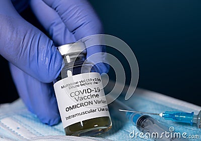Close up of bottle of new Covid-19 vaccine for Omicron variant wtih gloved hand Stock Photo
