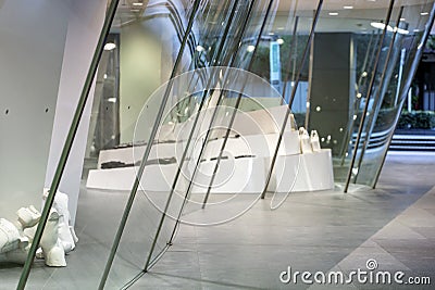 Close-Up the Bottom View of Double Curve Glass Panel of the Showcase. Curved of Shop Windows Editorial Stock Photo