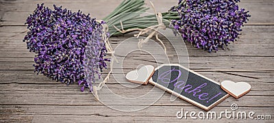 Close up of bouguet of violet purple lavendula lavender flowers herbs with wooden pendant with the word: Stock Photo