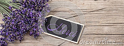 Close up of bouguet of violet purple lavendula lavender flowers herbs with wooden pendant with the word: Stock Photo