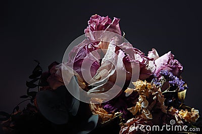 Close up of bouquet of dried flowers over dark background with copy space Stock Photo