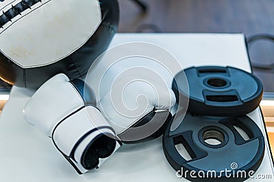 Close up of boxing gloves on table. Pair of white boxing gloves. Stock Photo