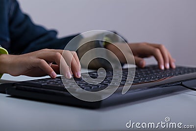 Close-up of boy playing on computer Stock Photo