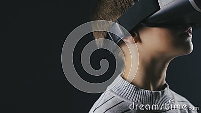 Close-up Boy 10 Years Old Using a Virtual Reality Helmet. Child Getting