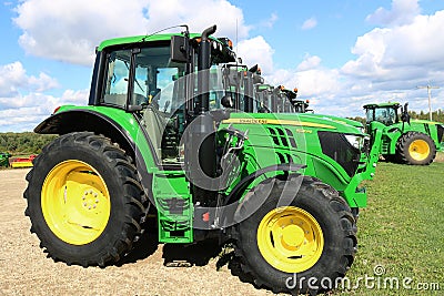 Close up of brand new John Deere cab tractor at head of row Editorial Stock Photo