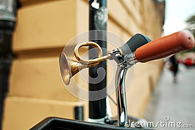 Close-up of a brass retro horn on a bicycle handlebar Stock Photo