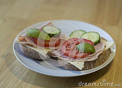 Close up bread sandwich with ham cheese sliced cucumbre tomatoes Stock Photo