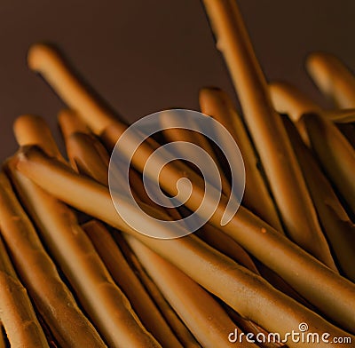 Close up of breadsticks on black background created using generative ai technology Stock Photo