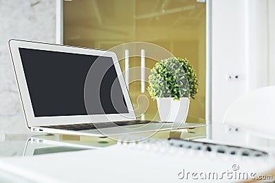 Bright desk top with empty laptop Stock Photo