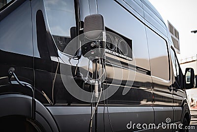 close-up of broadcast van, with microphone and cable visible Stock Photo