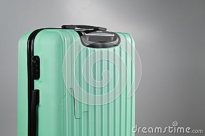 Close-up of a broken suitcase on a white background. Damaged baggage during the flight. Stock Photo