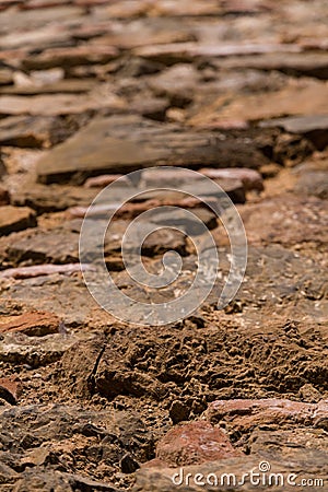 Detail of A Weathered Brick Wall on a Sunny Day Stock Photo