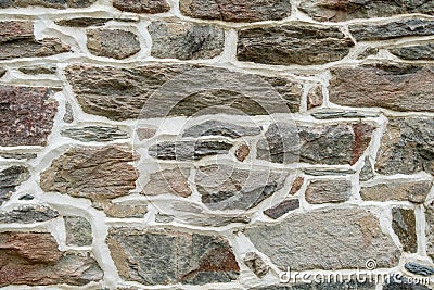 Close Up of Brown Stone Wall with Plaster Stock Photo