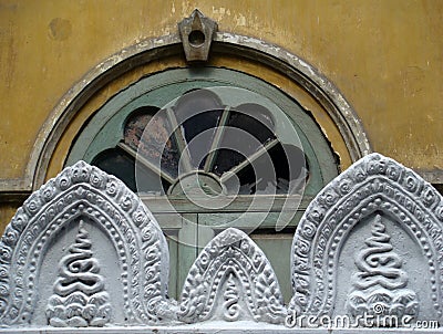 Close-up of a Buddhist temple`s broken window Stock Photo