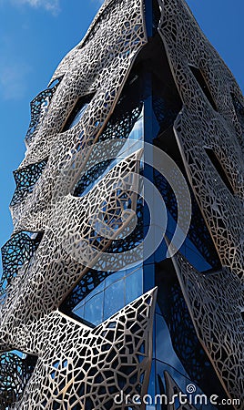 A close up of a building with a sky background and floating metallic details. AI generated, AI generative, AI generativ Stock Photo