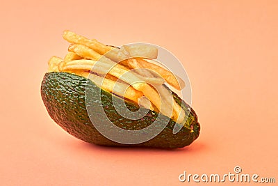 Close up bunch of fries inside of green avocado peel. Stock Photo