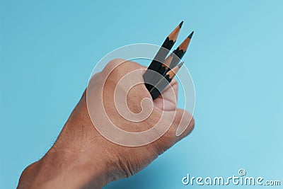 a close up of a bunch of pencils in hand Stock Photo