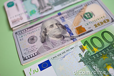 close up bundle of money Euros, dollars, rubles banknotes on the blue background, business, finance, saving, banking concept Stock Photo